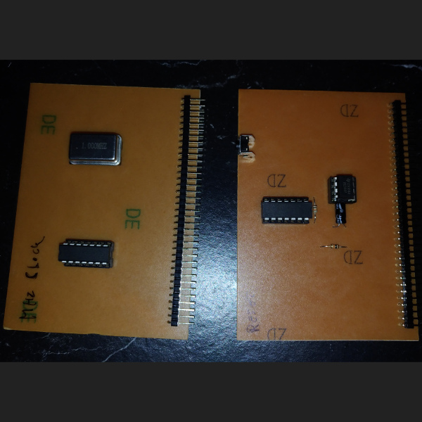 The new MHz clock module and the reset/power up module.